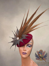 Load image into Gallery viewer, Bianca - Burgundy wool base with an array of golden pheasant and guinea fowl feathers
