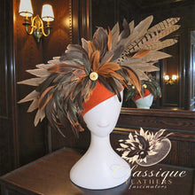 Load image into Gallery viewer, Burnt orange 100% wool teardrop fascinator with natural pheasant and rooster feathers, finished with a diamante spent shotgun cartridge, handmade in Britain.
